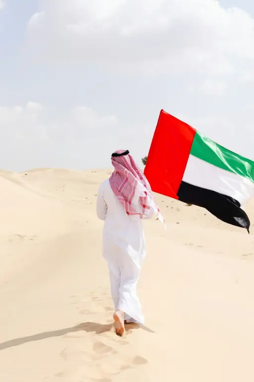 UAE Flag Sand Dunes Man walking